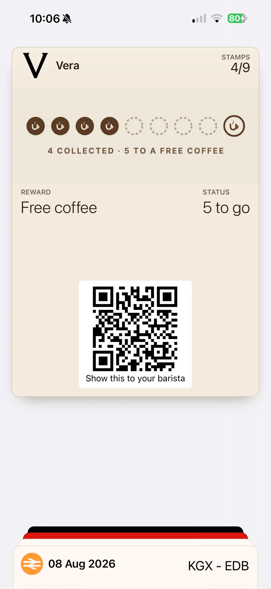 The same thing for a different café, Vera: their loyalty card in Apple Wallet in their own cream and dark brown, 4 of 9 coffee-cup stamps collected.